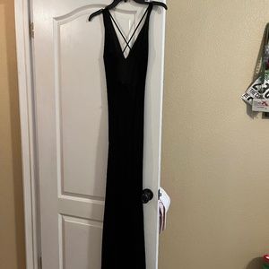 Long  black sexy dress with crisscross straps in the back, slit in the front!